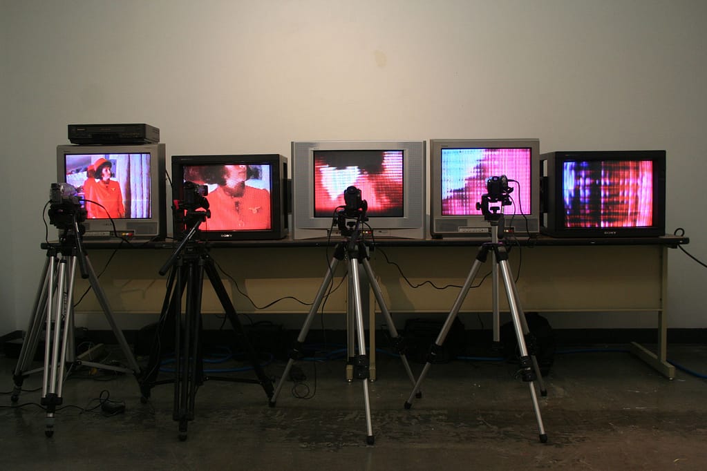 Installation with five vintage TVs live-monitoring their own image 