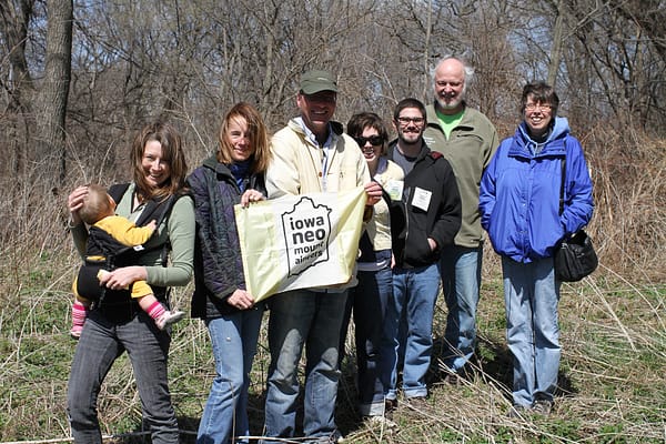 The Iowa Neo-Mountaineers pose with private property owners whose land represents one of the highest peaks in Johnson County